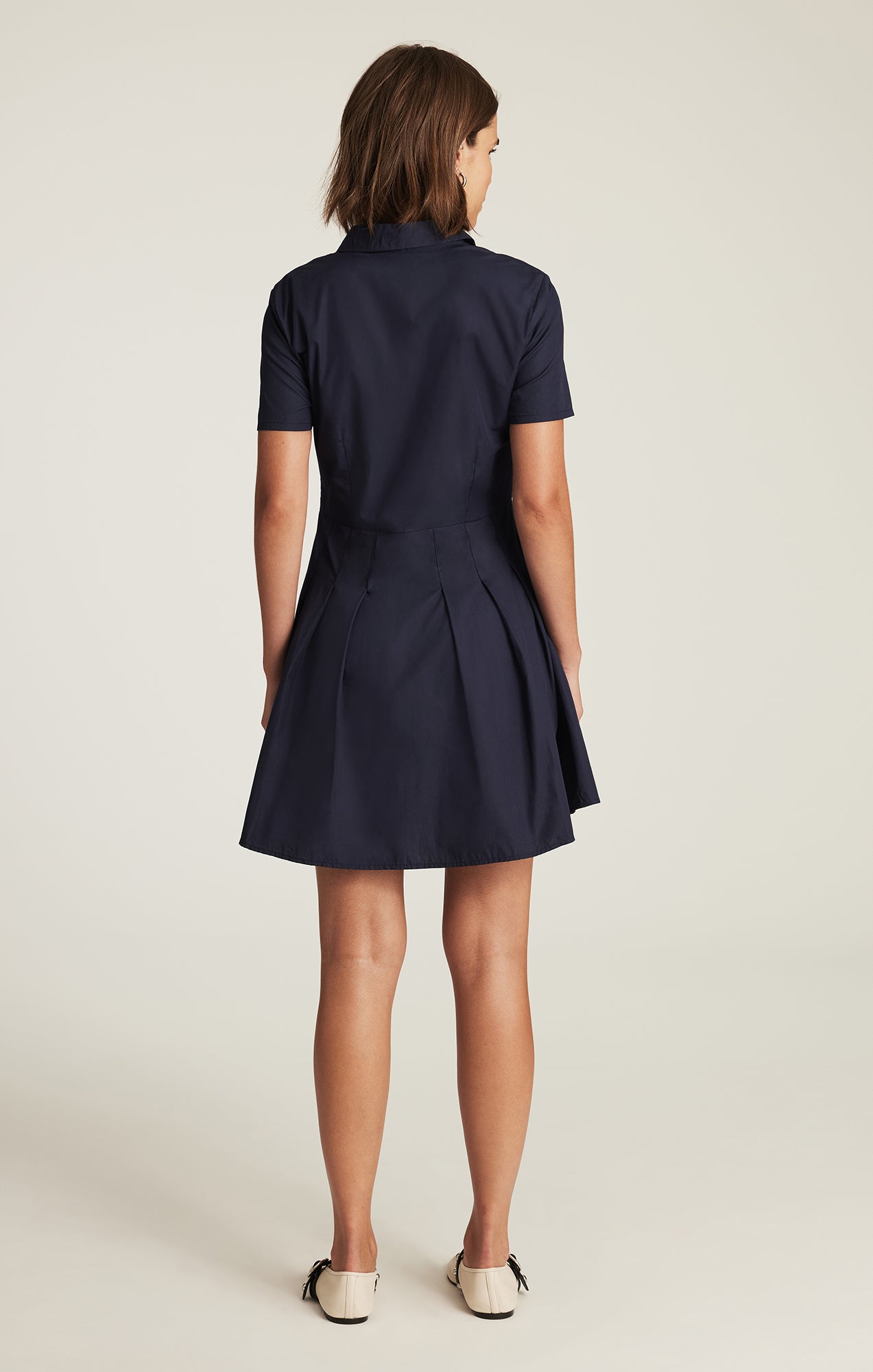PLEATED MINI DRESS IN NAVY BLAZER