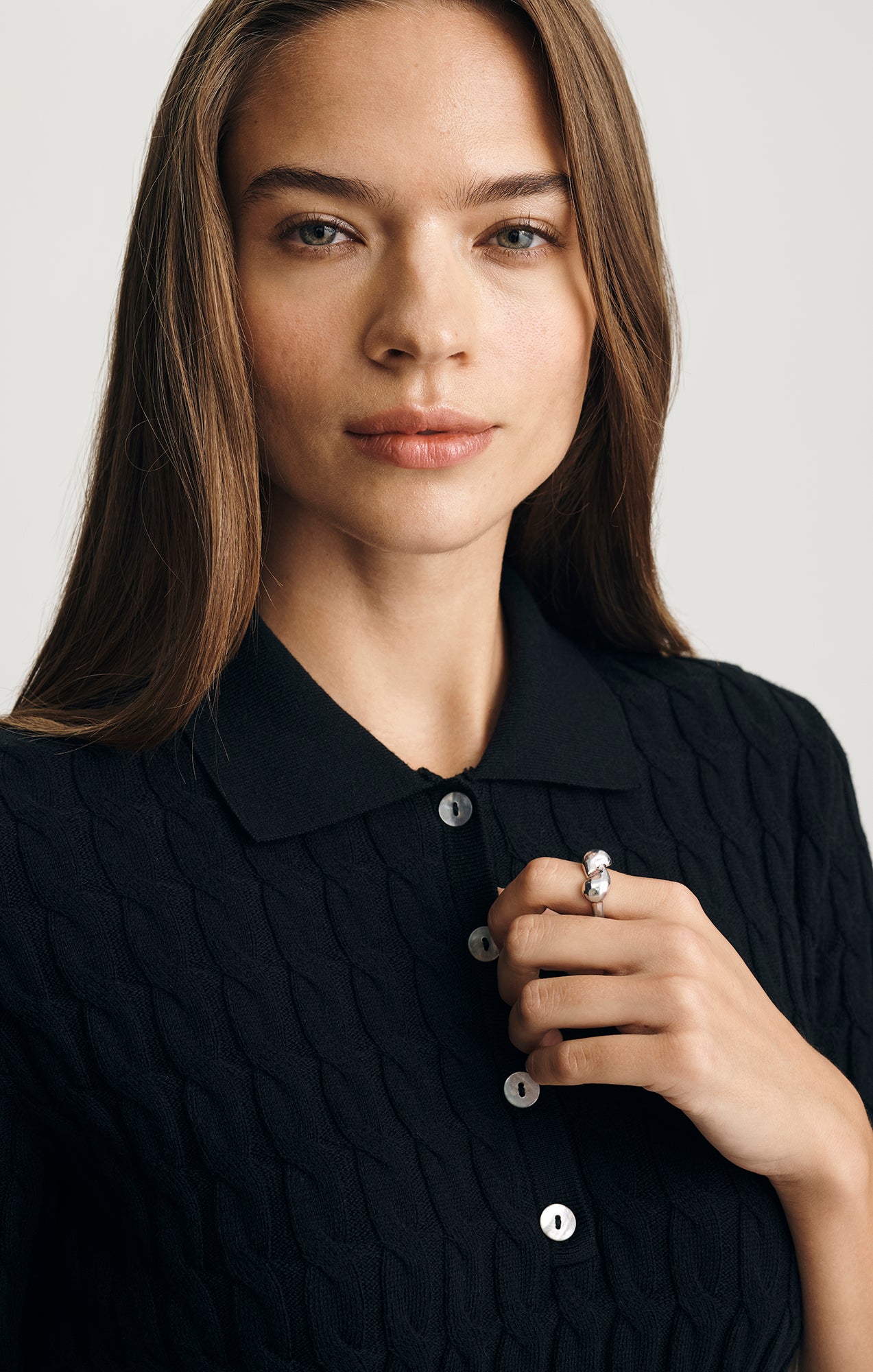 EDITION CABLE-KNIT POLO SWEATER IN BLACK