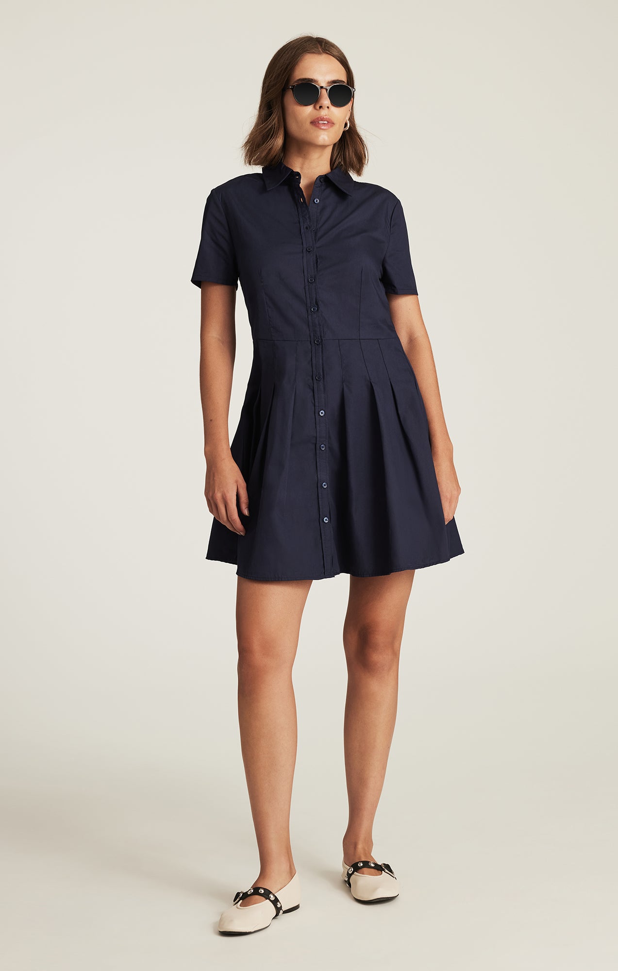 PLEATED MINI DRESS IN NAVY BLAZER