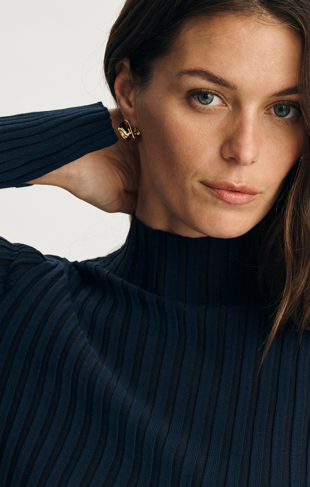 ASYMMETRICAL MOCK NECK SWEATER IN BLACK IRIS