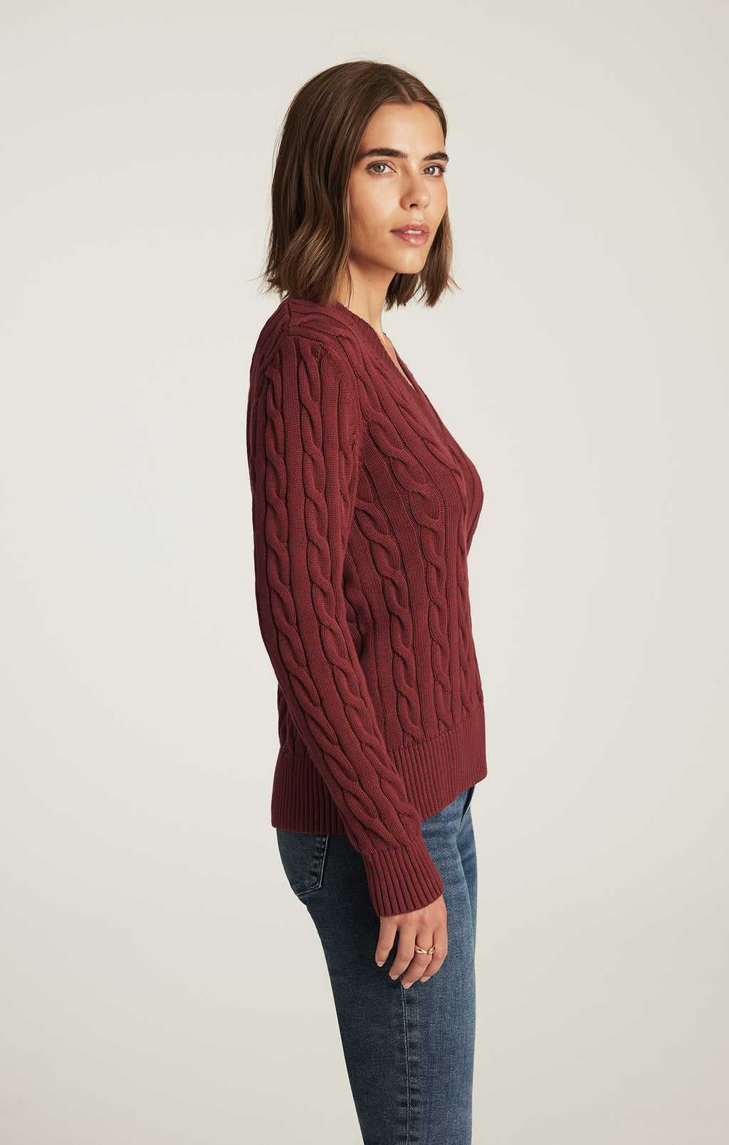 CABLE-KNIT V-NECK SWEATER IN POMEGRANATE