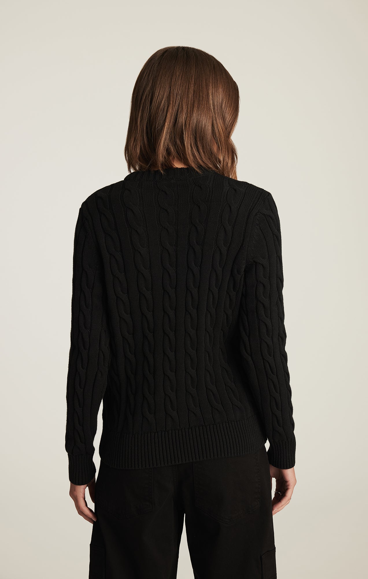 CABLE-KNIT CREW NECK SWEATER IN BLACK