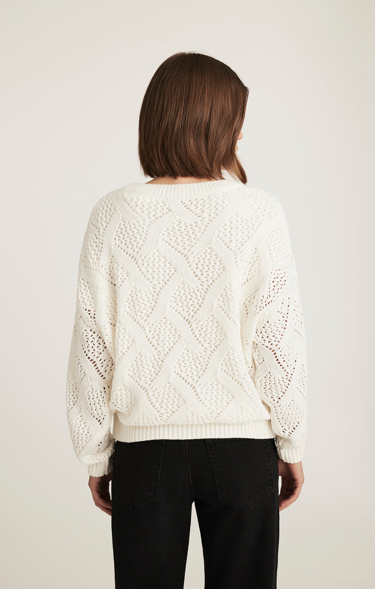 CABLE-KNIT SWEATER IN ANTIQUE WHITE