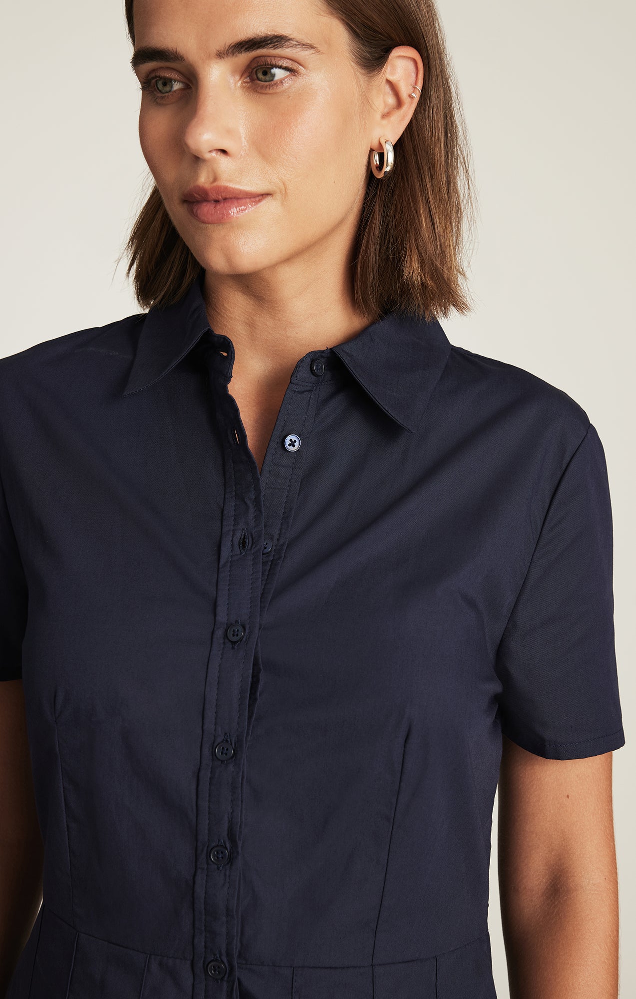 PLEATED MINI DRESS IN NAVY BLAZER
