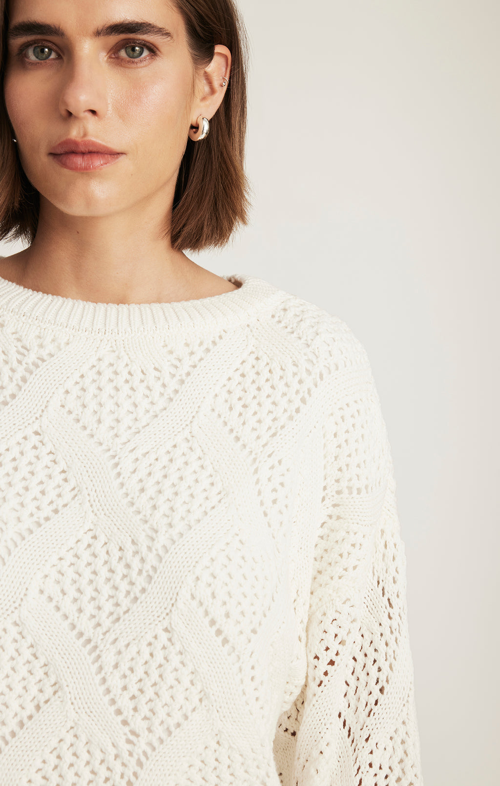 CABLE-KNIT SWEATER IN ANTIQUE WHITE