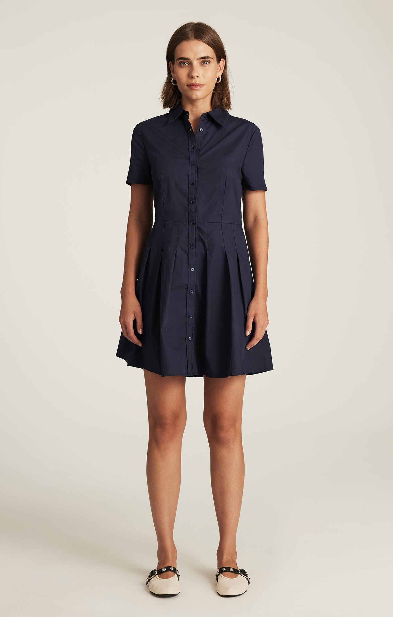 PLEATED MINI DRESS IN NAVY BLAZER