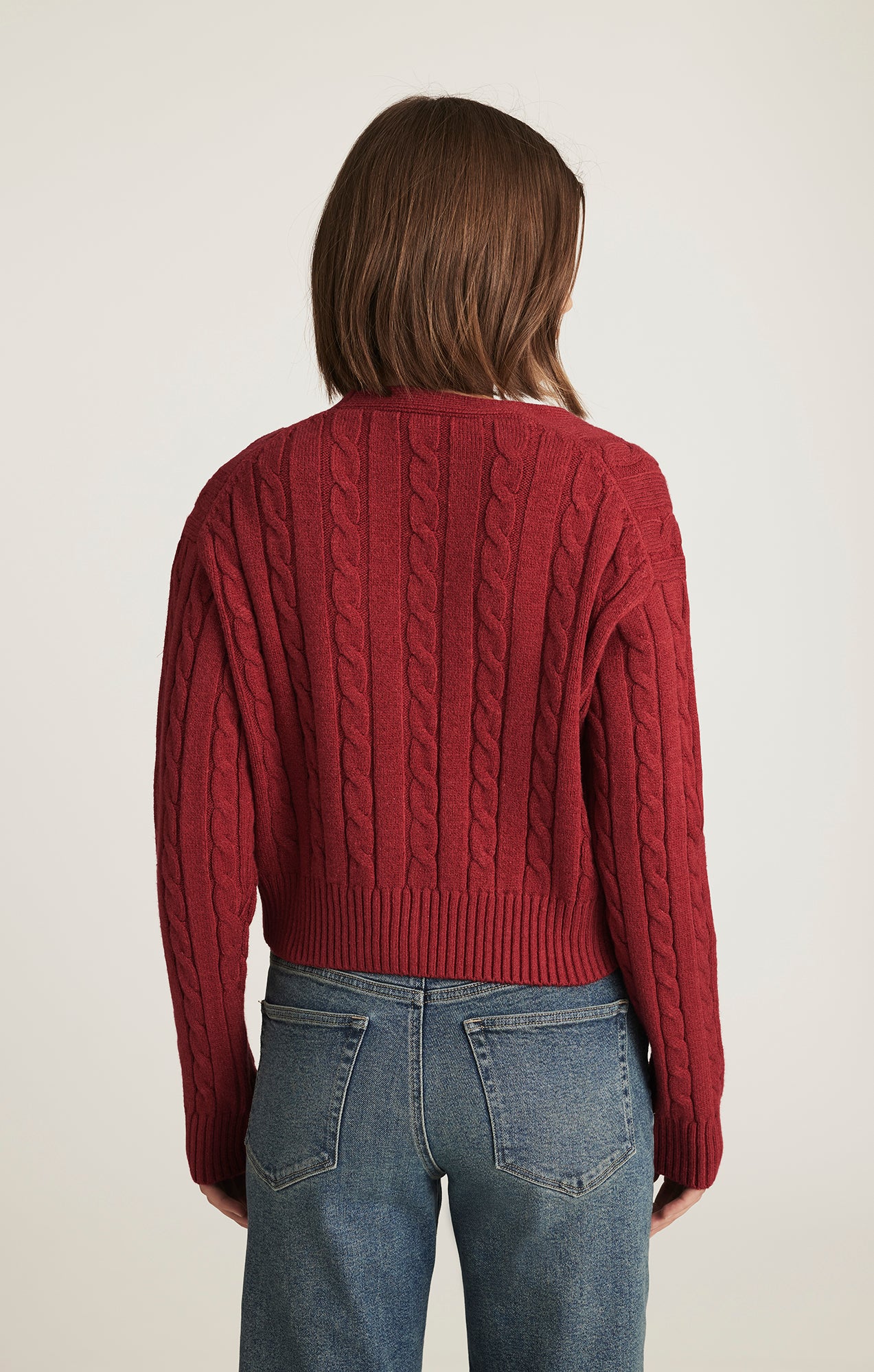 CROPPED CABLE-KNIT CARDIGAN IN RIO RED