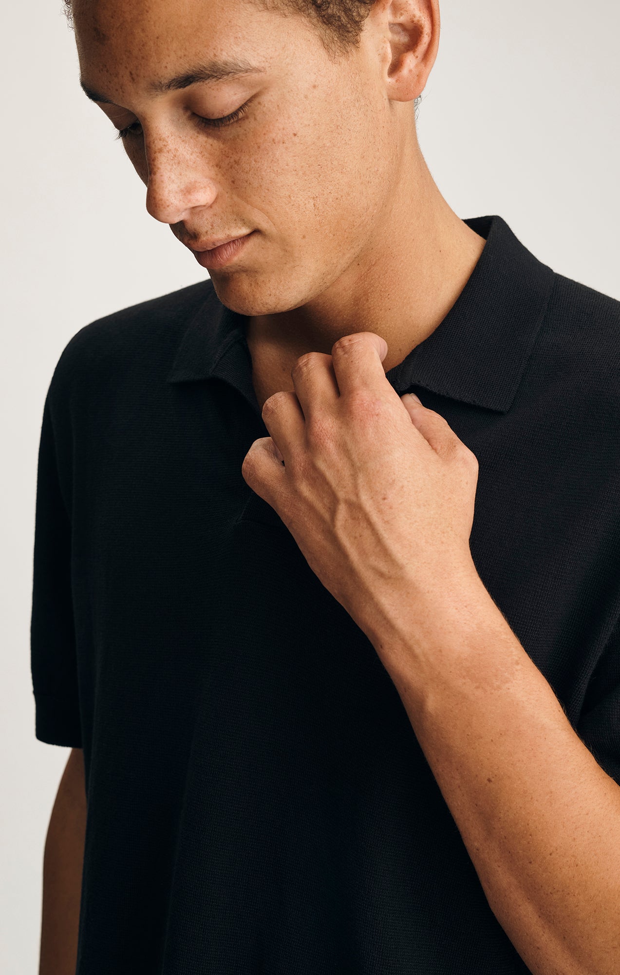 SHORT SLEEVE BUTTON-UP SWEATER IN BLACK