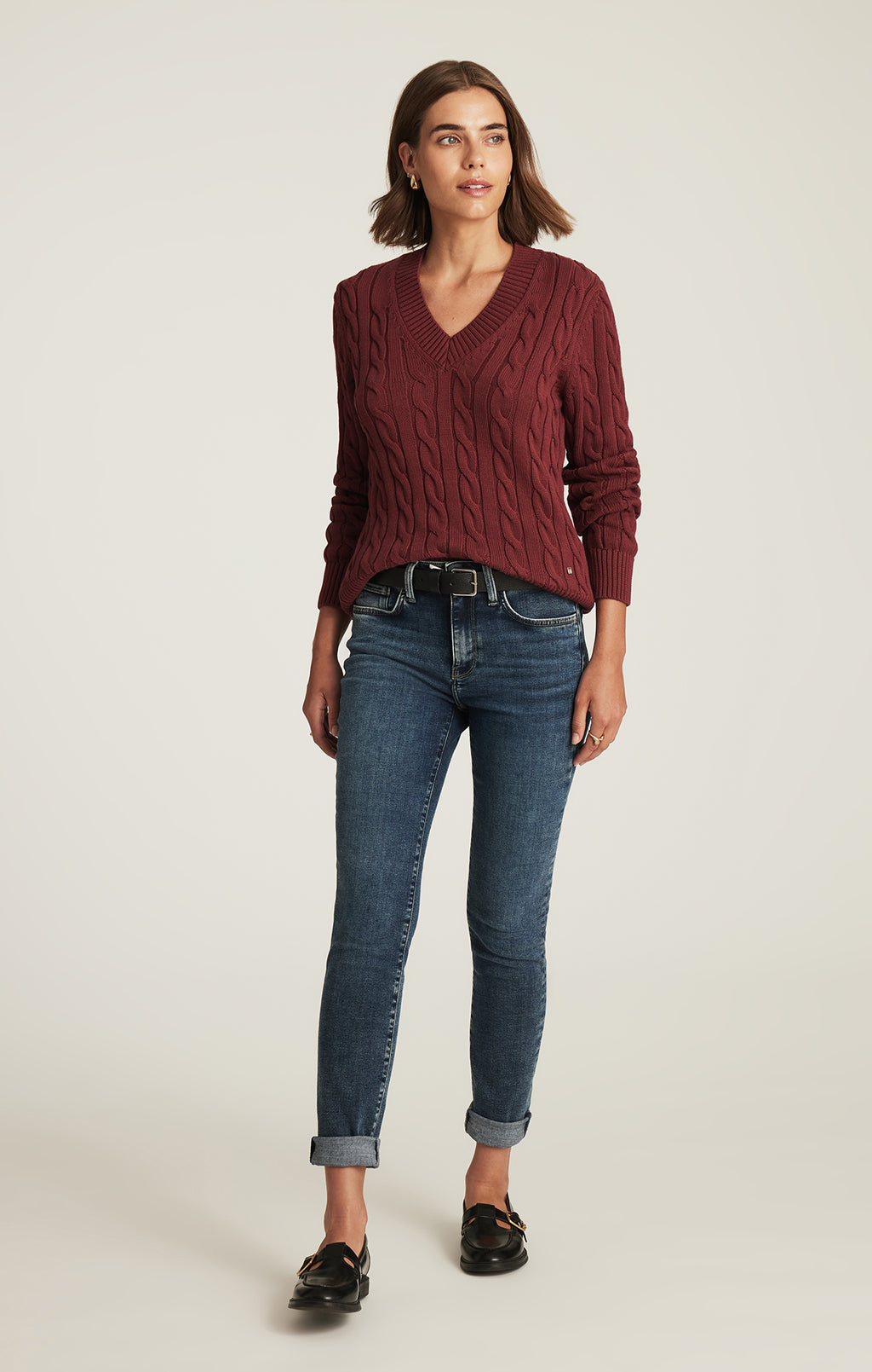 CABLE-KNIT V-NECK SWEATER IN POMEGRANATE
